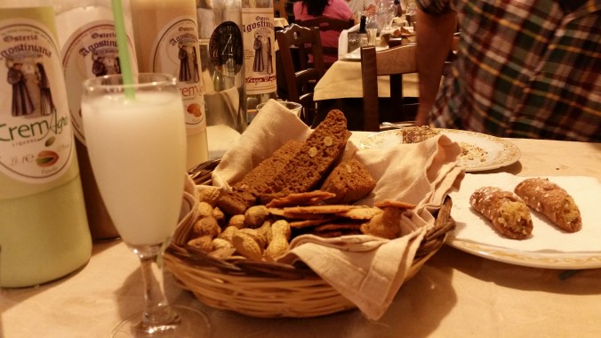 Five bottles of hooch, a basket of stuff, a slurpee, cannoli, and other desert. Crazy!