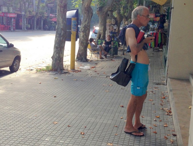 This man is carrying his thermos of water, which he uses to refill his mate cup. Apparently, this drink also keeps you thin.