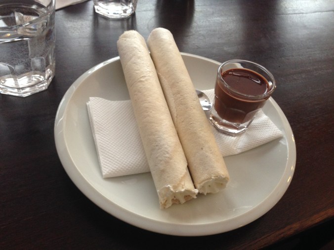 Priming the pump with horice, thin-rolled wafers stuffed with whipped cream. 